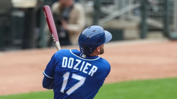 May 30, 2021; Minneapolis, Minnesota, USA; Kansas City Royals designated hitter Hunter Dozier (17) hits a solo home run against the Minnesota Twins in the ninth inning at Target Field. Mandatory Credit: David Berding-USA TODAY Sports